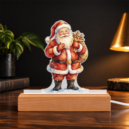 Santa — toy sack over his shoulder, standing on snow